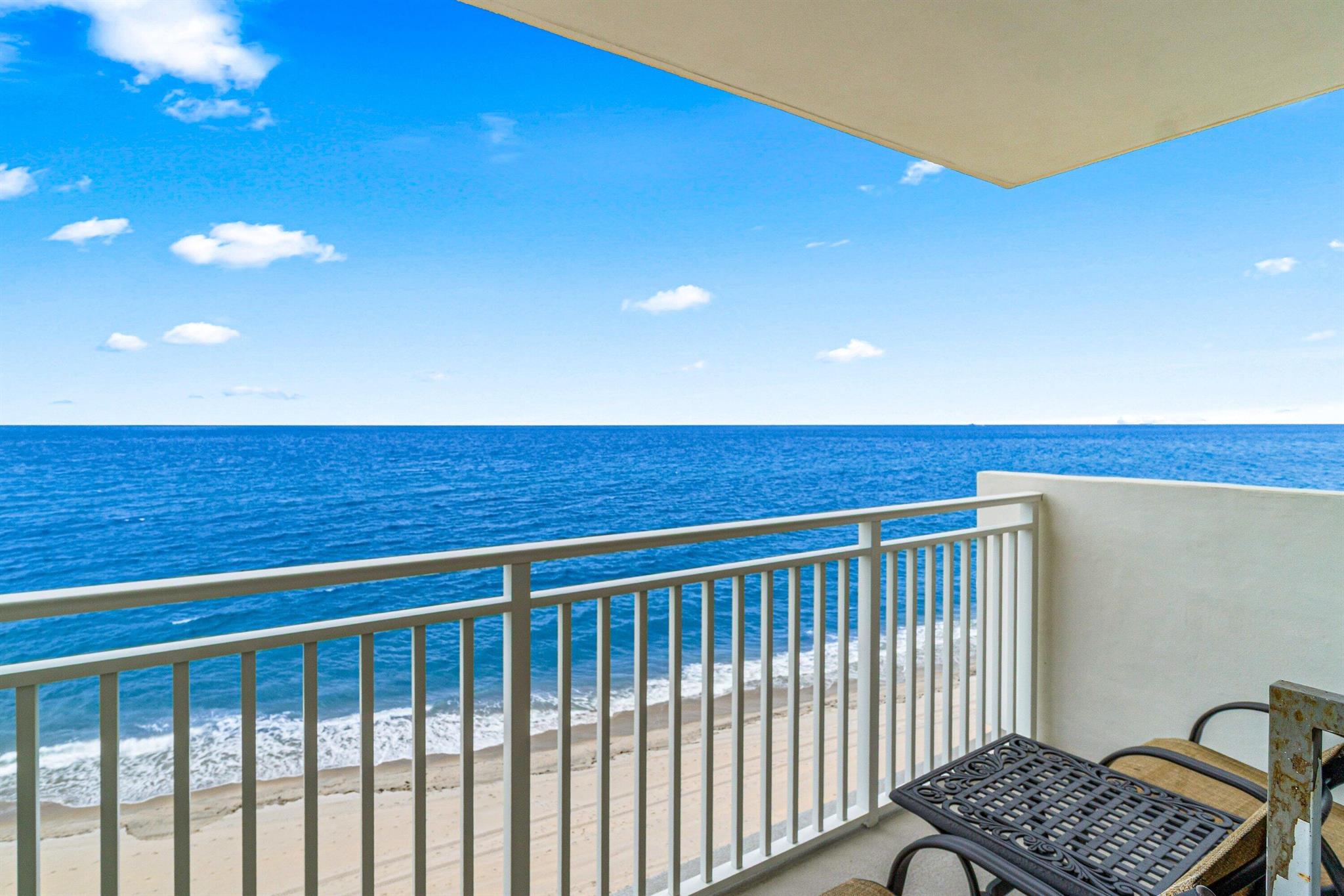 Furnished Annual Rental - Rarely available, direct East-facing oceanfront condo with two private balconies! This stunning southeast corner residence offers the feeling of living on a cruise ship, surrounded by the sparkling Atlantic and nestled among Highland Beach's prestigious oceanfront estates. Completely renovated and beautifully furnished, this 2-bedroom, 2-bath condo showcases high-end finishes throughout. Features include a chef's kitchen with top-of-the-line appliances, spacious living areas with stylish and comfortable seating, and serene bedrooms with plush bedding. Additional conveniences include in-unit washer/dryer, high-speed Wi-Fi, Smart TVs, and basic cable. Enjoy breathtaking, unobstructed views of the ocean from sunrise to sunset. Step directly onto the pristine white-