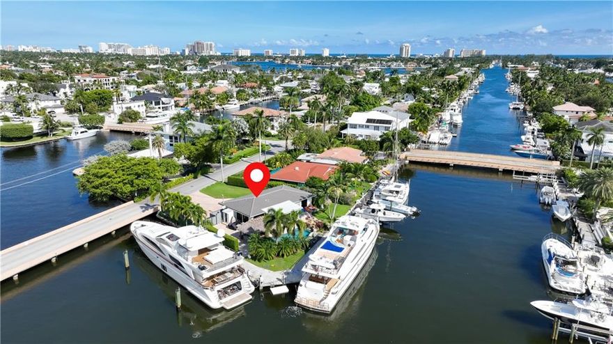 ATTN YACHT OWNERS!! 250' of Deep Waterfront dockage! 100' plus Yacht? Bring it! 33' tender? Put it on the lift! (2) waverunners & a dinghy? Drive up on the JetDock!! Fabulous Point Lot w/Large Turning Basin in Fort Lauderdale. Lots of PROTECTED Dockage for all the toys!. 3 Phase electric. This type of dockage is hard to find at any residence! Only a few minutes to Port Everglades & the Ocean!! Beautiful 4 Bed / 3.5 Bath w/Split Bedroom Plan. HUGE Modern Kitchen, Sparkling Floors throughout. Panoramic Water Views, NEW ROOF! Tropical Freeform Pool and Hot Tub. Expansive Patios w/Travertine Pavers surrounded by lush landscaping and grassy play areas enhance your Ft. Lauderdale lifestyle in this Piece of Paradise!! Private & quiet, you won't want to leave!! Plenty of parking out front, too!!