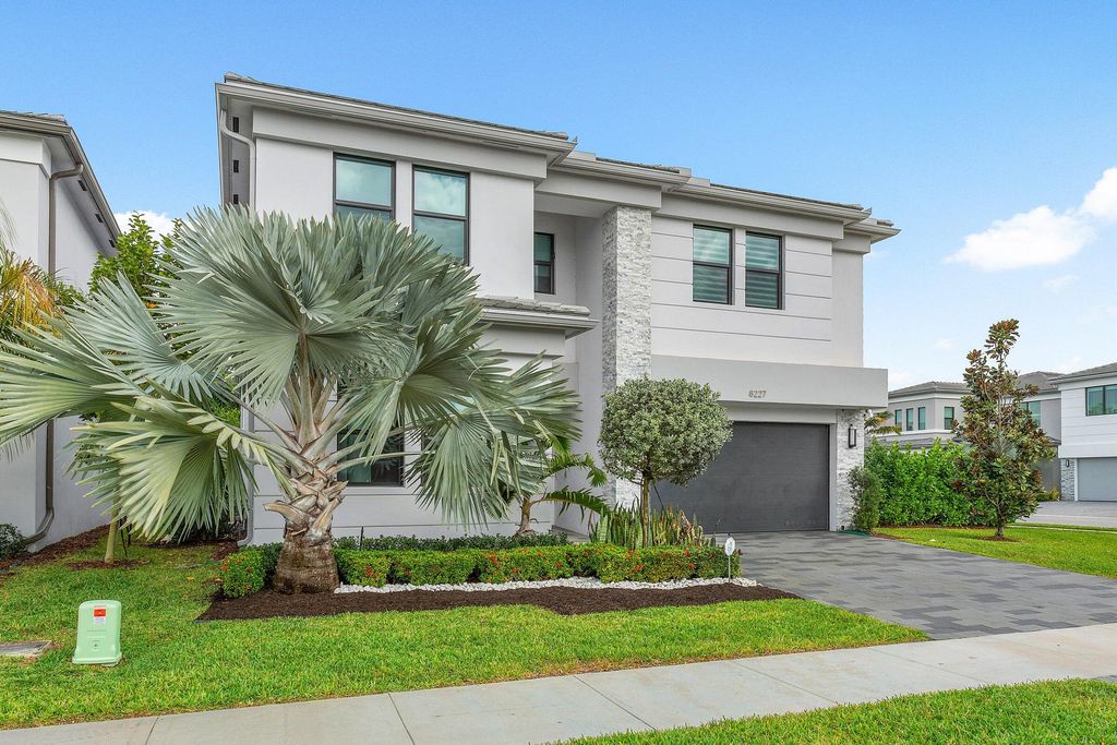 Photo of 8227 Oceanus Dr, Boca Raton, FL 33496 (MLS # B26001079)