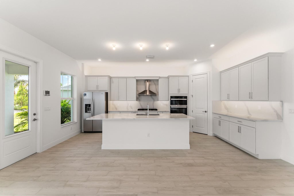 Photo of 785 SW Prairie Avenue, Palm City, FL 34990 (MLS # B26023921)