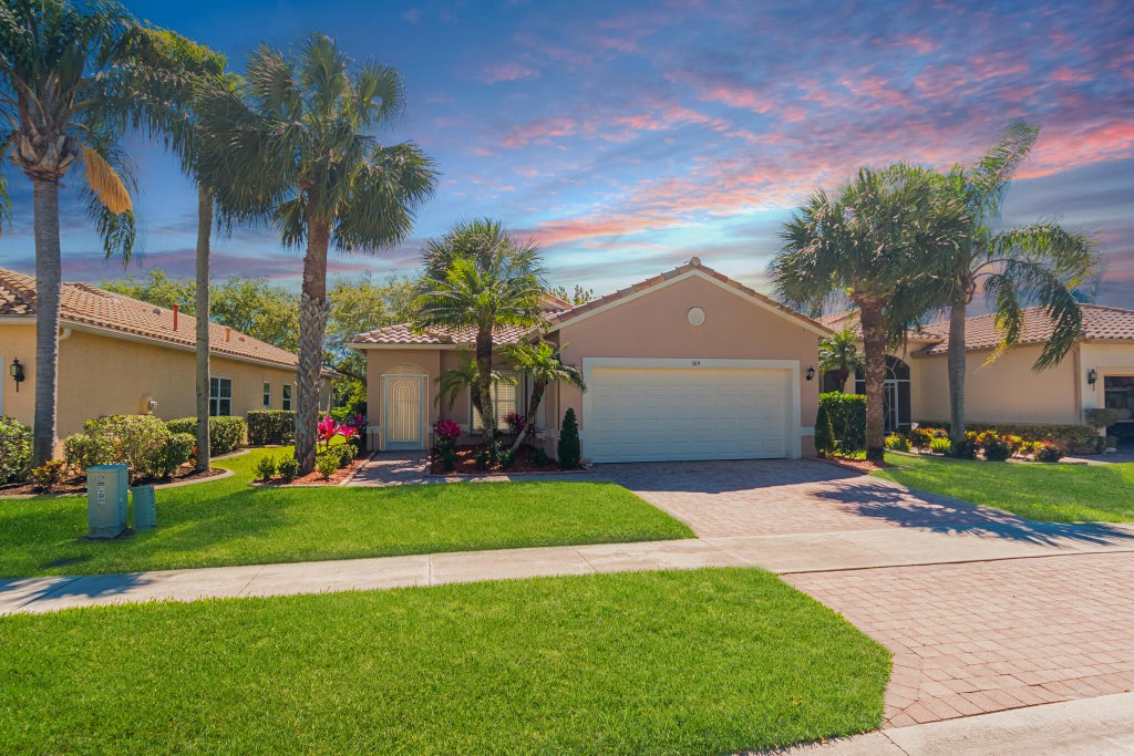 Photo of 309 NW Alana Avenue, Port Saint Lucie, FL 34986 (MLS # R11069094)