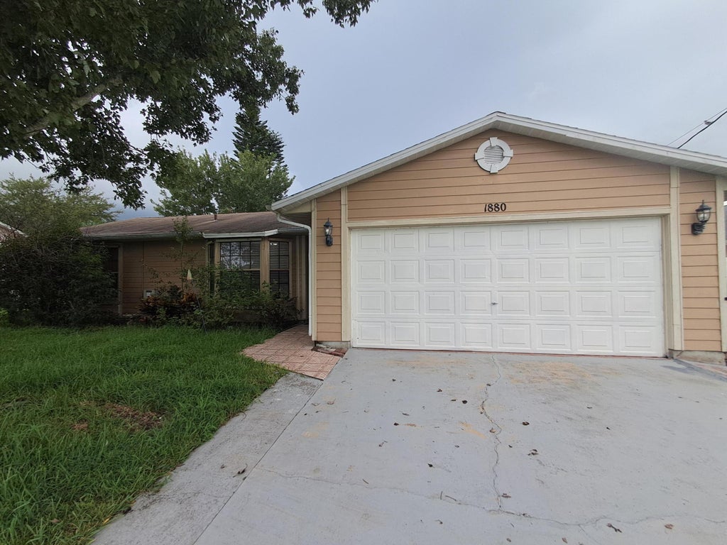 Photo of 1880 SW Bradway Lane, Port Saint Lucie, FL 34953 (MLS # B26071983)