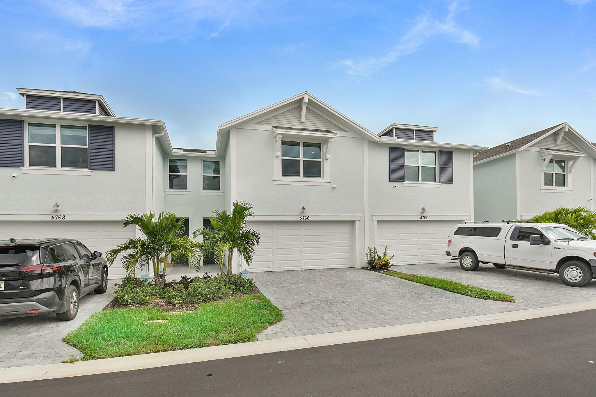 This almost new two-story, smart and energy efficient townhome offers 3 bedrooms and 2.5 baths with a serene view of the community lake. As you walk in the front door you are greeted with an open and airy living and dining space. The well laid out kitchen has stainless steel appliances, granite counters, pendant lights, tile backsplash, new cabinet handles and wood slats on the island. The 2nd floor primary bedroom has a large walk-in closet and great view of the lake. The loft area is the perfect extra space for a home office or kids homework area. Enjoy the double driveway and 2-car garage with durable epoxy flooring. No rear neighbors with plenty of backyard privacy. Located in a desirable new development, with easy access to great Stuart downtown restaurants, shopping, beaches, & I-95