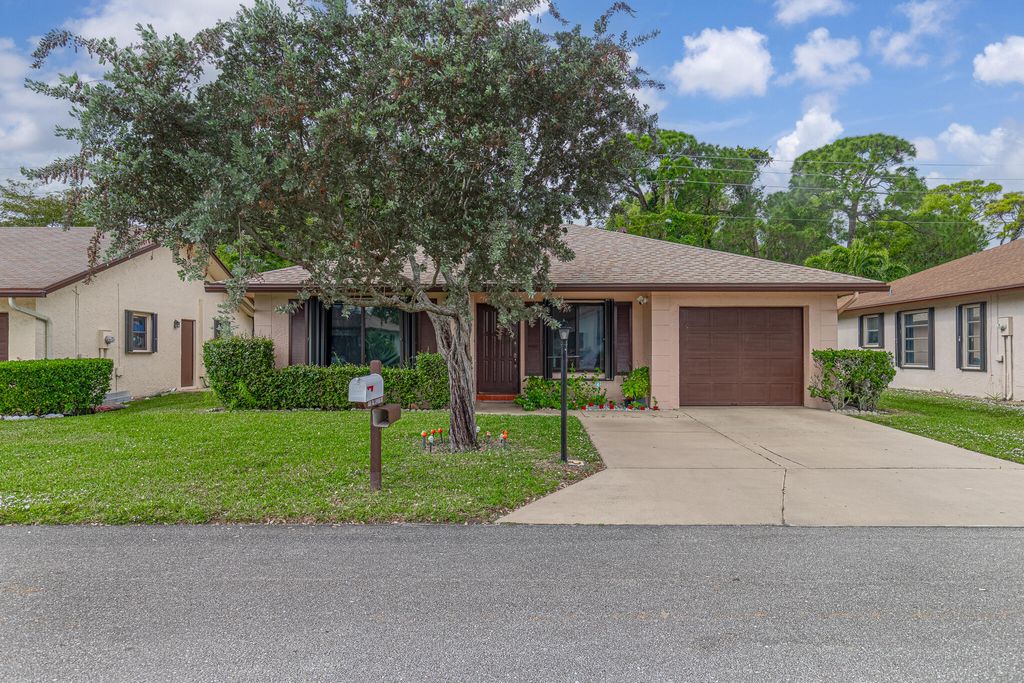 Photo of 6335 Tall Cypress Circle, Greenacres, FL 33463 (MLS # R11142120)