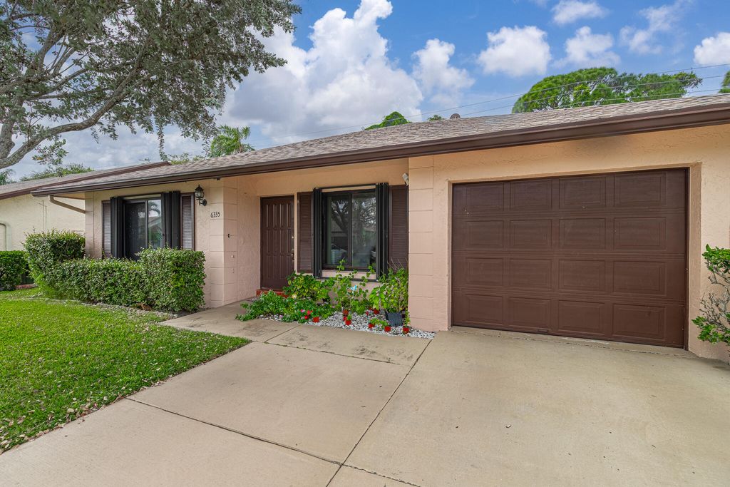 Photo of 6335 Tall Cypress Circle, Greenacres, FL 33463 (MLS # R11142120)
