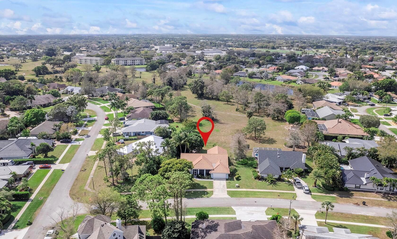 Experience Wellington living at its best in the perfect Location! 4-bedroom, 3-bath corner-lot home in Chatsworth Village. NO HOA, Offering over 2,000 sq ft, 1/4 to 1/2 Acre, soaring ceilings, and oversized bedrooms, this home blends comfort, privacy, and style. The split bedroom layout includes a primary suite, two ensuite bedrooms, plus a versatile bonus room perfect for an office or guest space.Recent improvements include a newer tankless water heater (2024), new washer (2025), new dishwasher (2025), newer AC(with warranty), Xfinity smart security system, central vacuum, modern tile, and wood flooring. The kitchen is equipped with stainless steel appliances, granite countertops, a Summer kitchen, a built-in grill, and a wine cooler. Walking distance to Equestrian Festival,and shops