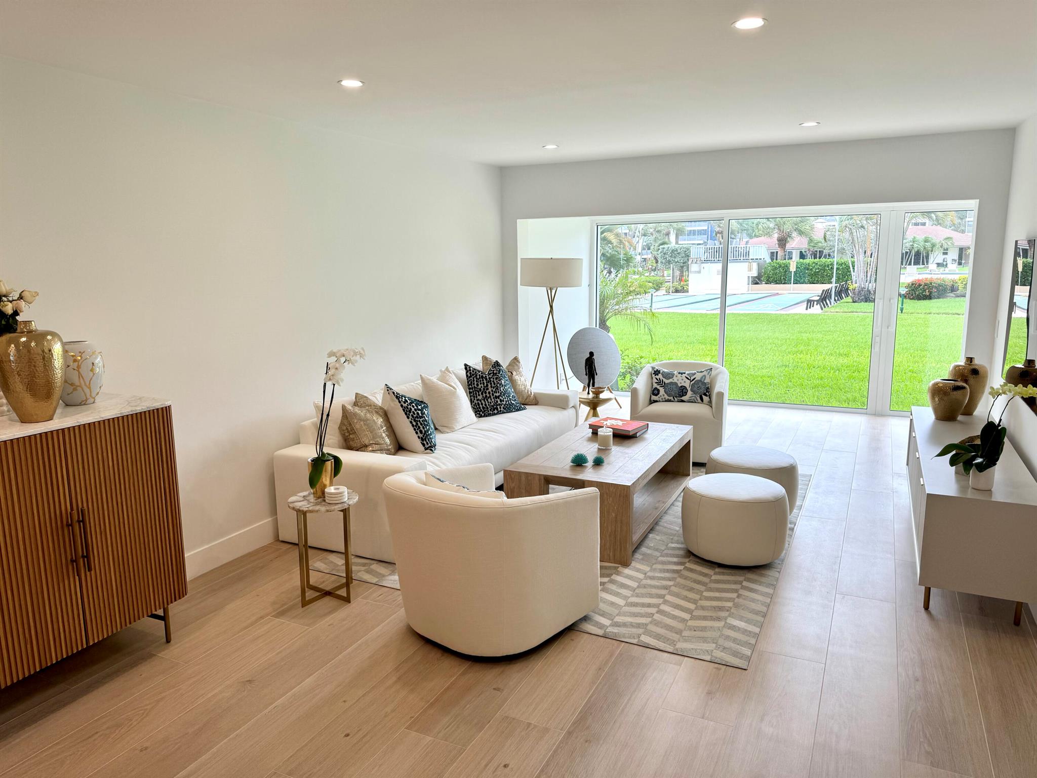 This luxurious 2-bed, 2-bath, fully renovated 55+ condo in Delray Beach offers high-end finishes throughout. Features include smart LED lighting, brand new appliances, marble kitchen & baths, impact windows and doors throughout, Italian tile floors, real wood cabinets, and a reverse osmosis water filter. Both bedrooms have blackout shades, custom closets and the living room has electric privacy shades. Additional include in-unit washer/dryer, smart locks, new A/C, and a small enclosed office/storage space. Enjoy water views, boat dockage available for only $3/ft per month. Condo fee covers cable, water, exterior maintenance, water views and more. Amenities include a gym, 2 pools, library, clubhouse, shuffleboard, BBQ area and game room. Available furnished or unfurnished. Must see!