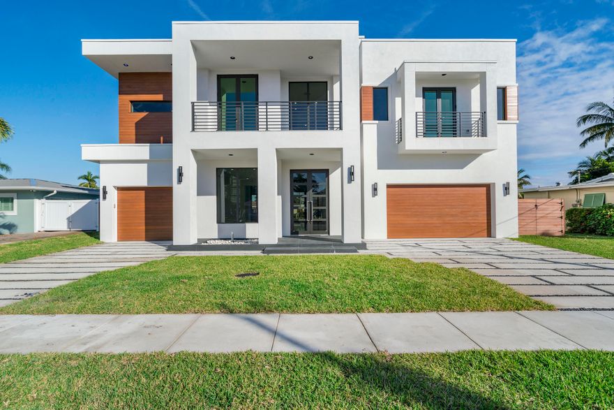 Brand New Modern Waterfront Masterpiece - 6 Bedroom 6.5 Bath 3 Car Garage 5000+ Square Feet of Luxury Living. Stunning Modern Design featuring only the finest of materials. Gourmet Kitchen with European Style Cabinets, Exquisite Stone, and Miele Appliances. This home features a 60 Foot Dock with 80 feet of Deepwater No Fixed Bridge Ocean Access.