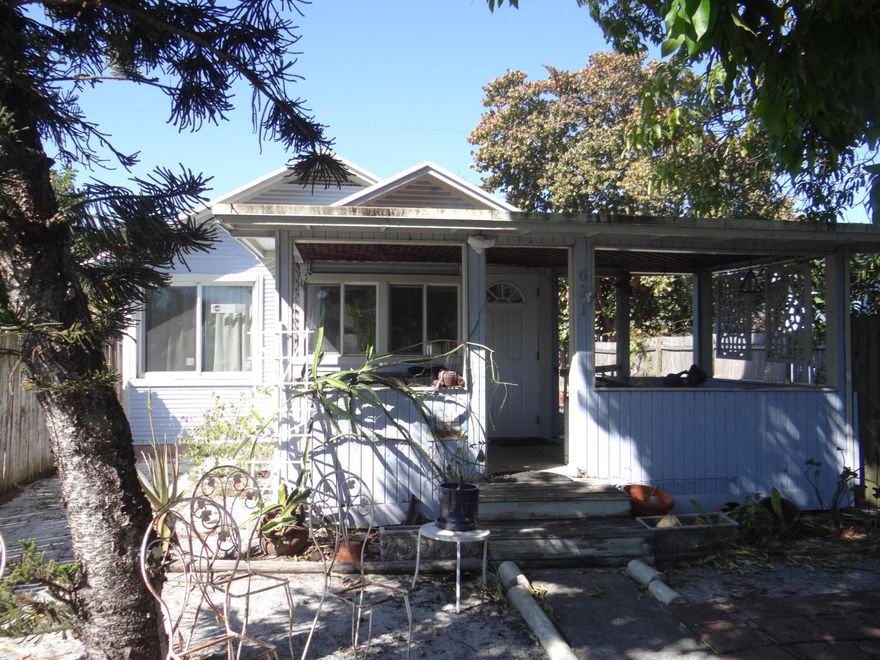 Charming 1925 Historic Cottage - Timeless Beach House!

Step into classic Old Florida charm with this enchanting 3-bed, 1-bath bungalow, built in 1925. Gleaming original oak hardwood floors, century-old built-in cabinets, and exquisite custom millwork showcase true period craftsmanship.

Relax on the welcoming covered front porch overlooking the prolific mango tree and a peaceful, generous yard ideal for outdoor living or future upgrades. The spacious detached outbuilding (garage/storage) offers versatile possibilities--workshop, studio, guest space, or beyond.

Nestled in serene Tropical Ridge, Lake Worth Beach's historic gem feels like a quiet retreat, yet it's just blocks from vibrant downtown shops, dining, beaches, and culture.

Updates include 2023 AC, impact windows, upgrade