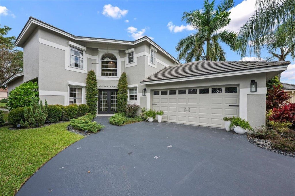 Photo of 149 HARBOR LAKE Circle, Greenacres, FL 33413 (MLS # B26094495)
