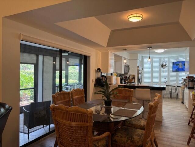 Nestled within the prestigious gated community of Jonathan's Landing in Jupiter, Fl. this 2 bedroom, 2 bath 1st floor garden condo awaits. Thoughtfully designed and furnished for your seasonal enjoyment , this condo boasts an updated kitchen, bathrooms, and a great room that combines the living and dining area for any family with extra seating at the bar and in the spacious kitchen. Sip on your morning coffee on the screened porch lanai that looks into a quiet garden of palms. or enjoy cocktails and appetizers in the nearby gazebo graced with bird life on the canal. With a large heated pool only a few minutes walk enjoy a complimentary aquasize class or relax with a good book. The inland waterway, and ocean beckons with incredible sunrises and turquoise waters. Watersports available