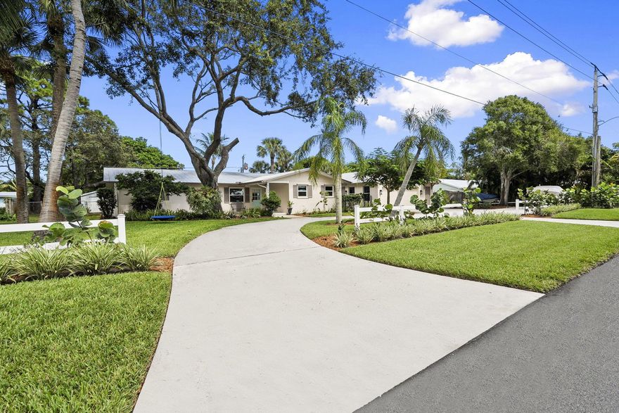 Discover this rare double-lot opportunity in ''America's Happiest Seaside Town.'' Designed by a renowned architect to highlight warm, functional elegance, this CBS pool home with a metal roof sits on over 1/2 acre in the heart of Stuart. The 3-bedroom, 2.5-bath main home offers open living with space for a home office, hurricane shutters, and a fully fenced yard. A detached 2.5-car garage and private 1-bedroom, 1-bath guest suite create endless possibilities--multi-generational living, in-law quarters, income-producing rental, or private retreat. Outdoors, enjoy a free-form pool, oversized yard, and plenty of room for a boat, RV, pets, and toys--without HOA restrictions. Just a short stroll to downtown Stuart's shops, festivals, and waterfront dining, and minutes from Treasure Coast beache