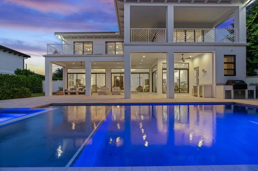 Stunning new construction completed in early 2020! Premier estate home is nestled in Palm Beach Gardens on 80' of waterfront with an infinity pool/spa and full summer kitchen! Professionally outfitted and decorated by a Manhattan-based world-renowned designer, this 4 bedroom, 5 bath home is light and airy with coffered ceilings and an open-concept floor plan. The kitchen features Thermador appliances and offers a large pantry. The first floor also boasts a versatile guest suite and a full cabana bath. The second level offers a gorgeous master suite with generous his and her closets and a beautiful en suite bath with spacious shower and soaking tub. Two additional bedrooms and baths plus a den/office complete the upper floor. Private elevator, patio bug screens and more. Bring your boat!