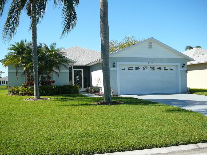 THIS 3/2/2 WATERFRONT CBS HOME IN THE ACTIVE ADULT GATED COMMUNITY OF PALM GROVE IS IN MINT CONDITION. IT IS SITUATED ON ONE OF THE LARGER LOTS WITH APPROXIMATELY 85 FEET OF ROAD FRONTAGE AND 55 FEET ON THE LAKE. NEW ROOF IN 2021, ACCORDIAN SHUTTERS THROUGHOUT MAKES THIS HOME SAFE AND SECURE. ENJOY, PICKLEBALL,TENNIS, BOCCE, SHUFFLEBOARD SWIMMING, BIKING AND SO MUCH MORE. THE OVER 8,000 SF CLUBHOUSE HAS IT ALL, WORKOUT ROOM, KITCHEN, GAMEROOM, PERFECT FOR ENTERTAINING AND YOU ARE JUST STEPS AWAY FROM ALL OF THAT! THE HOME IS MOSTLY FURNISHED WITH TILE IN THE LIVING AREAS AND BERBER CARPET IN THE BEDROOMS. STAINLESS STEEL APPLIANCES, WASHER AND DRYER, BREAKFAST NOOK AND DINING AREA. PLANTATION SHUTTERS ON ALL THE WINDOWS AND SLIDERS, 10 X 27 COVERED PORCH OFFERS STUNNING LAKE VIEWS!