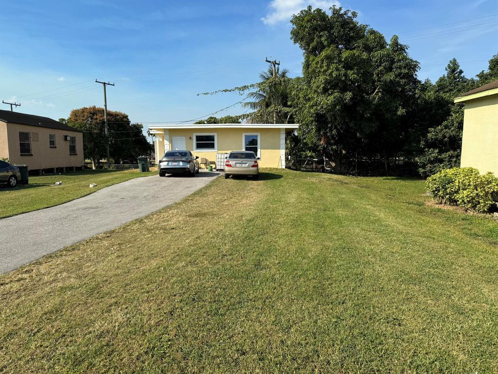 Photo of 648 SE 2nd Street, Belle Glade, FL 33430 (MLS # R11074313)