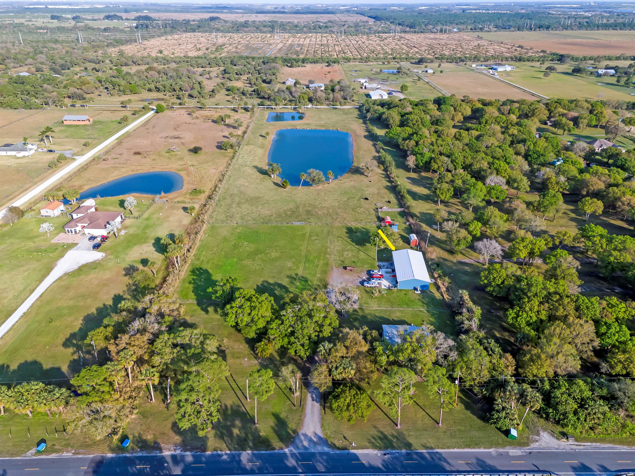 :Bring the Horses, RVs, & Boats! This rare location property with its many amenities is ready for new owners. Come enjoy the peace & serenity of this 3/2 home and a 2/2 Barndominium! Situated on a beautiful fenced 9.54-acre lot with a pristine two ponds, located just few minutes from I-95, Turnpike and many stores. The house is rented month to month for $2,200. Little red shed not included.