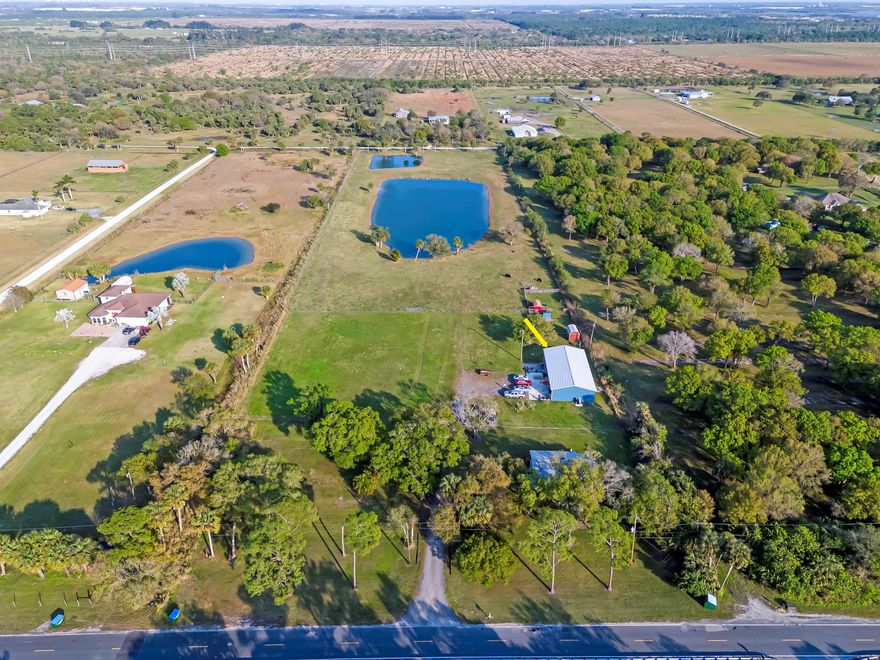 :Bring the Horses, RVs, & Boats! This rare location property with its many amenities is ready for new owners. Come enjoy the peace & serenity of this 3/2 home and a 2/2 Barndominium! Situated on a beautiful fenced 9.54-acre lot with a pristine two ponds, located just few minutes from I-95, Turnpike and many stores. The house is rented month to month for $2,200. Little red shed not included.Condo at Barn unpermitted.