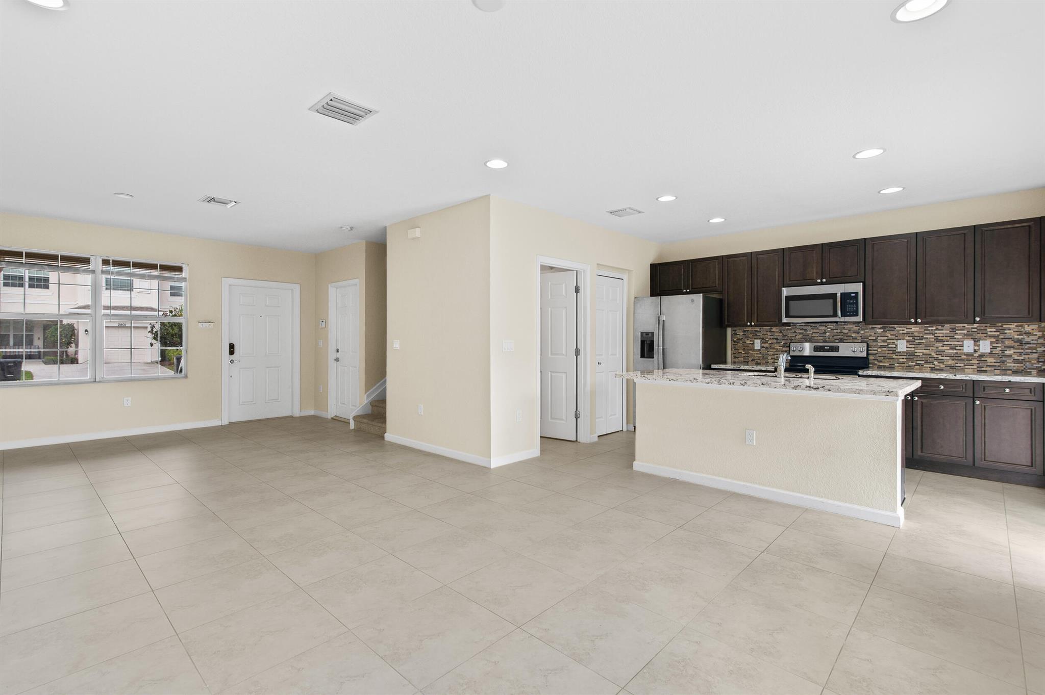 Better Than New! Spacious & Stylish Townhome in Vizcaya Falls Don't miss this incredible opportunity to own a beautifully maintained 3-bedroom, 2.5-bath townhome in the highly sought-after Vizcaya Falls community of St. Lucie West.Step inside to a bright and open main level featuring abundant natural light, modern tile flooring, and a spacious living and dining area perfect for entertaining. The gourmet granite kitchen is a true highlight, a center island, stainless steel appliances, and direct access to a private back patio overlooking a serene preserve--your perfect retreat for morning coffee or evening relaxation.Upstairs, you'll find three generously sized bedrooms and a laundry room with washer and dryer included. The luxurious primary suit