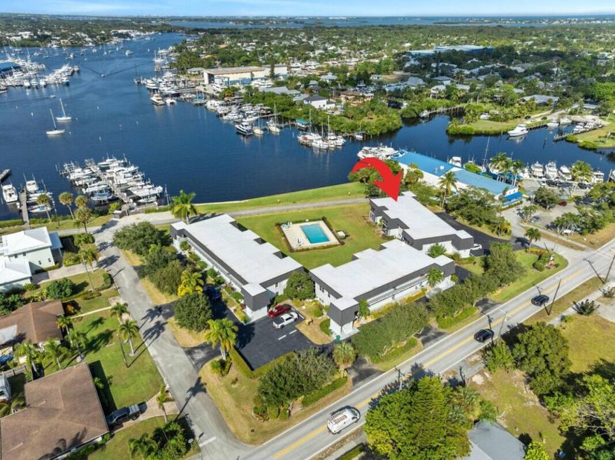 DEEP WATER DOCK on the desirable, well protected Manatee pocket to accommodate up to a 44 ft. boat! This 2/2 CBS condo comes with breathtaking views from the glass enclosed, corner unit! Enjoy the pleasures that only can be experienced from your private boat slip #7 just minutes from the St. Lucie Inlet. This community is only 20 units, and the pool overlooks the waterfront, walking distance to the historic Downton Port Salerno. New roof in 2024. These units rarely come available to the public!