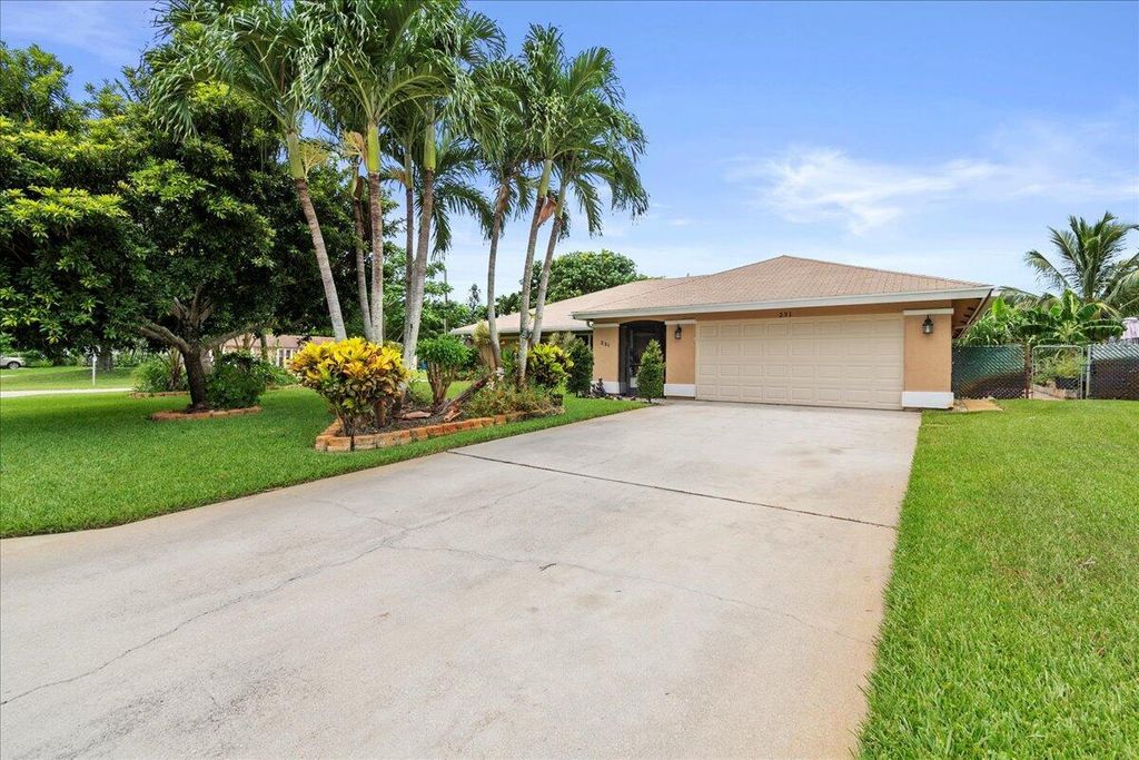 Photo of 231 Sandpiper Avenue, Royal Palm Beach, FL 33411 (MLS # R10903373)