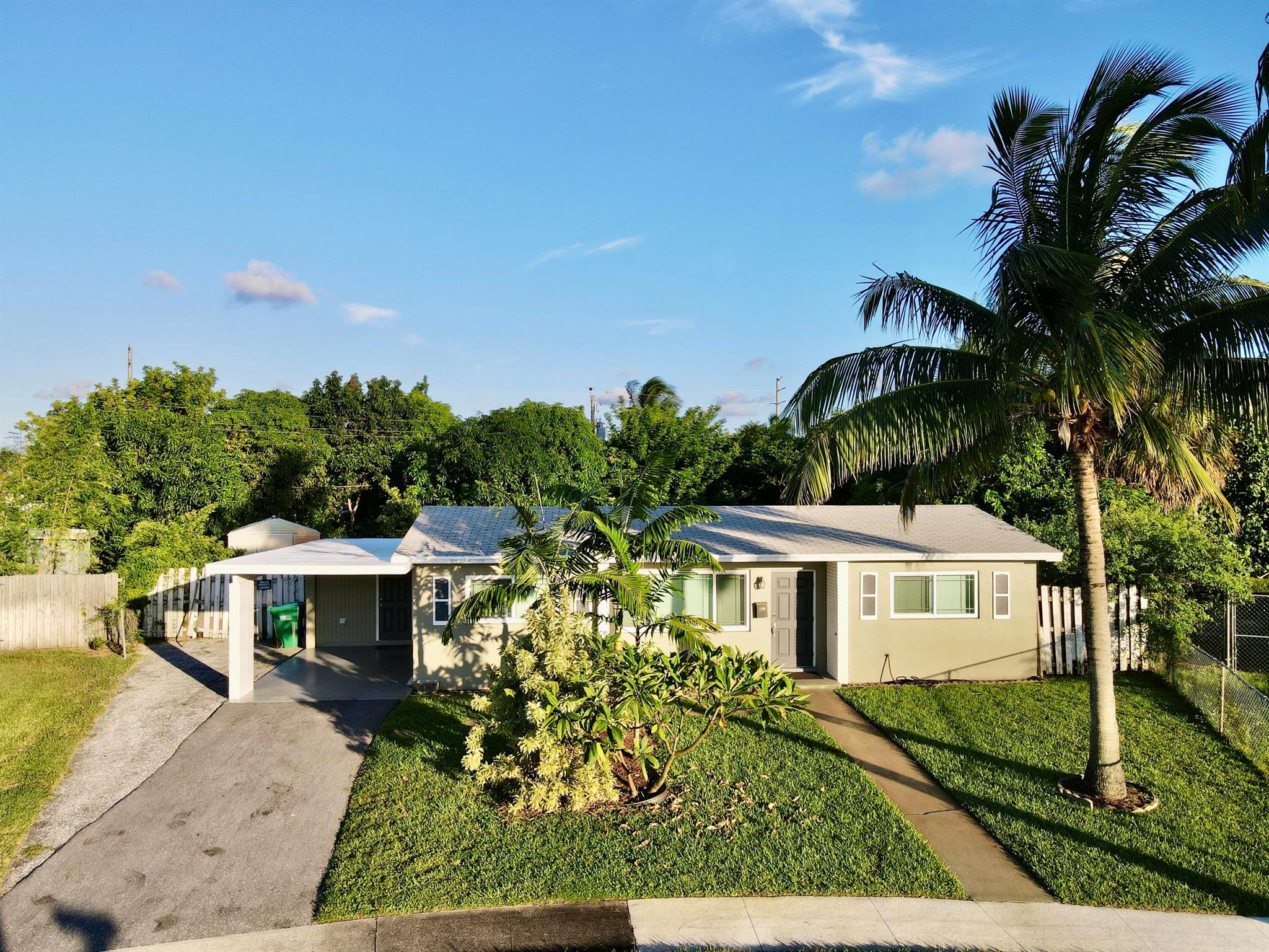 Beautiful and modern 3 bedroom 2 bathroom single family home, with a spacious backyard. This residence features luxury vinyl floors in kitchen and living areas, laminate wood in bedrooms, tiles in upgraded modern bathrooms. Central AC, stainless steel appliances in kitchen. Washer and Dryer installation is an option by the landlord. Minutes away from the beach., intracoastal, City Place, dining and shopping. Easy access to local amenities, schools, and major roadways, making daily commutes a breeze. NO pets. NO smoking inside property. Asking for last month and 2 security deposits, total 3 months to move in. First month free.Also available for short or mid-term rental, furnished for $3800 per month, 30 day minimum.