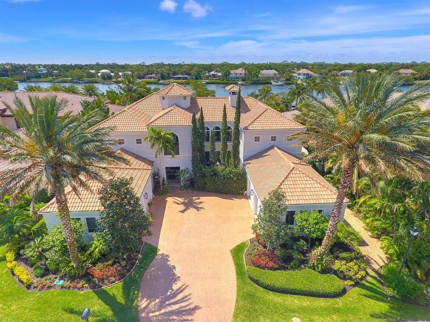 Timeless, quality construction paired with over-sized waterfront setting. 19100 SE Reach Island offers over 1/2 acre lot on 100 feet of Loxahatchee riverfront. This custom built home features 5 large bedrooms, library,  game room with bar, and theater. No shortage of space for family and guests at over 8,500 sq feet of living space. Kitchen is loaded with every high-end appliance imaginable. Master suites both up and down stairs. Resort style pool, patio, and summer kitchen make the perfect setting to enjoy South FL weather, privacy and river views. 4 car garage for extra storage. Hurricane-safe home with generator and full impact glass. Large upstairs terrace with unique bridge walk-over and long, scenic views of the water. Ocean access from private dock. A rare product.