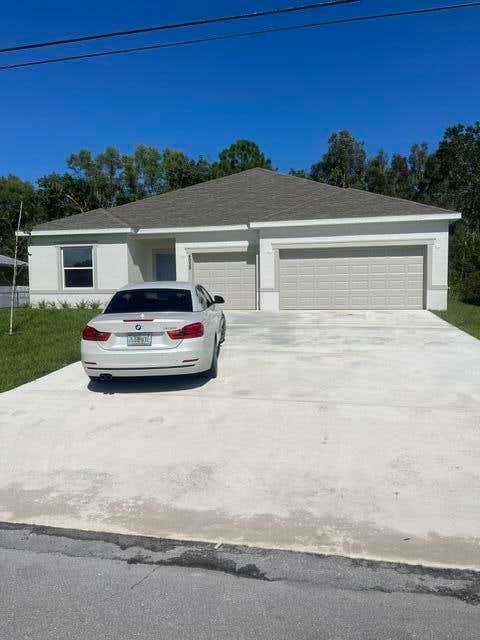 Photo of 4958 NW FLINTSTONE Avenue, Port Saint Lucie, FL 34983 (MLS # B26053113)