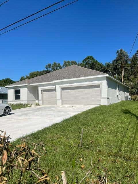 Photo of 4958 NW FLINTSTONE Avenue, Port Saint Lucie, FL 34983 (MLS # B26053113)