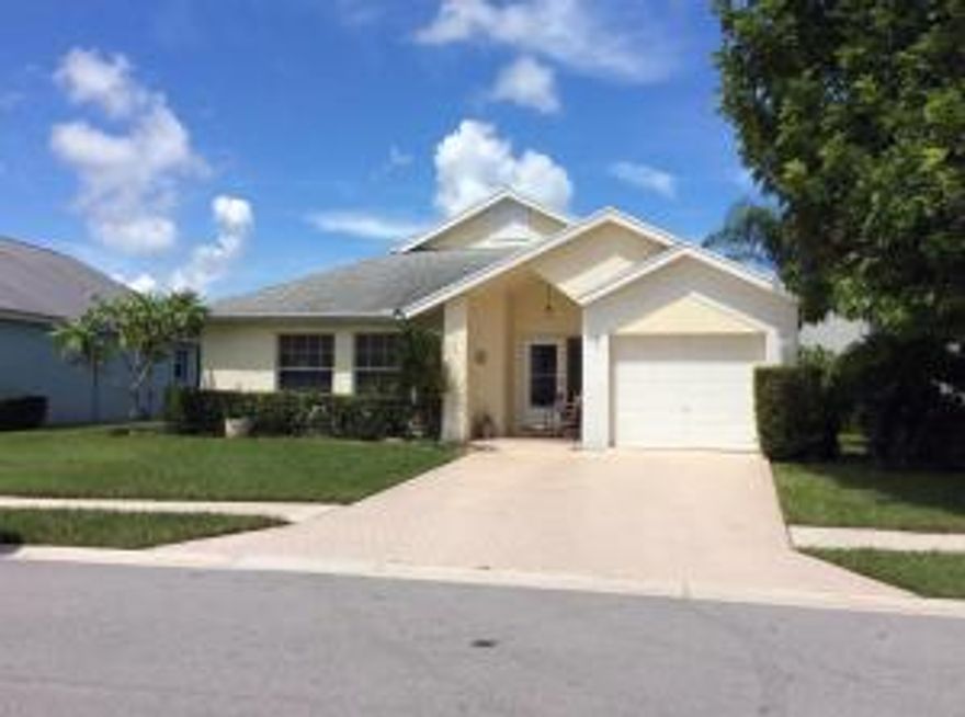 Great family home in a golf community. 3 bedroom 2 bath with an office and extra large patio, ceramic tile throughout living areas and carpet in bedrooms, high ceiling great light. Roof was replaced in 2008. Nice location and convenient to downtown Abacoa where you can enjoy live music and spring training.