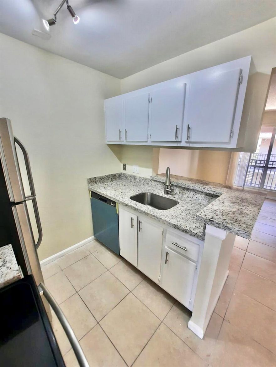 Cozy and bright third floor condo 1bedroom 1bath-Spacious with separate dinning area. Updated kitchen -Granite Countertop- Stainless Steel Appliances- Laundry Facilities. Great community close to I-95. Palm Beach Outlets. No pets allowed by Association. and WATER is included in the rent !