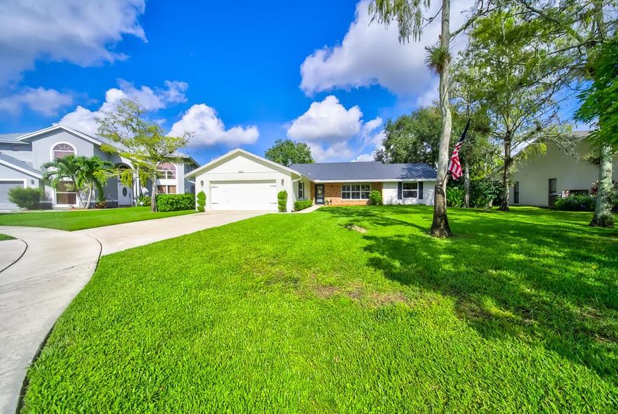 **MULTPLE OFFERS- SUBMIT HIGHEST AND BEST BY10/2. **Nestled in a serene cul-de-sac and spanning 1,665 square feet on a spacious .23-acre lot, this NON HOA property offers a perfect blend of comfort and style, with views of the canal.  As you enter, you are greeted by a beautifully painted interior, elevated ceilings, wood-look tile floors, and ample natural light. The formal dining room flows seamlessly into the inviting living room and family room, making it ideal for gatherings and entertaining guests. The guest bathroom has been thoughtfully designed with a double vanity and a convenient shower/tub combo.