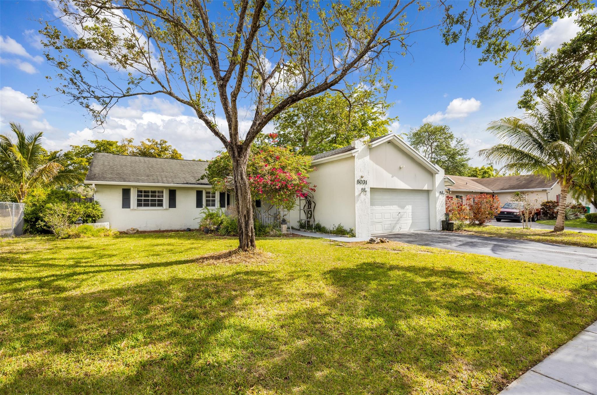 Beautifully updated 3-bedroom, 2-bath home with canal views. Features brand-new flooring, freshly painted interior, soaring ceilings, and abundant natural light. Enjoy cooking and entertaining in this modern kitchen with sleek cabinetry, stainless steel appliances, and new countertops. Private backyard and patio overlooks the tranquil canal — perfect for relaxing or entertaining. This home also features a two-car garage and accordion hurricane shutter throughout. This home is truly move-in ready.