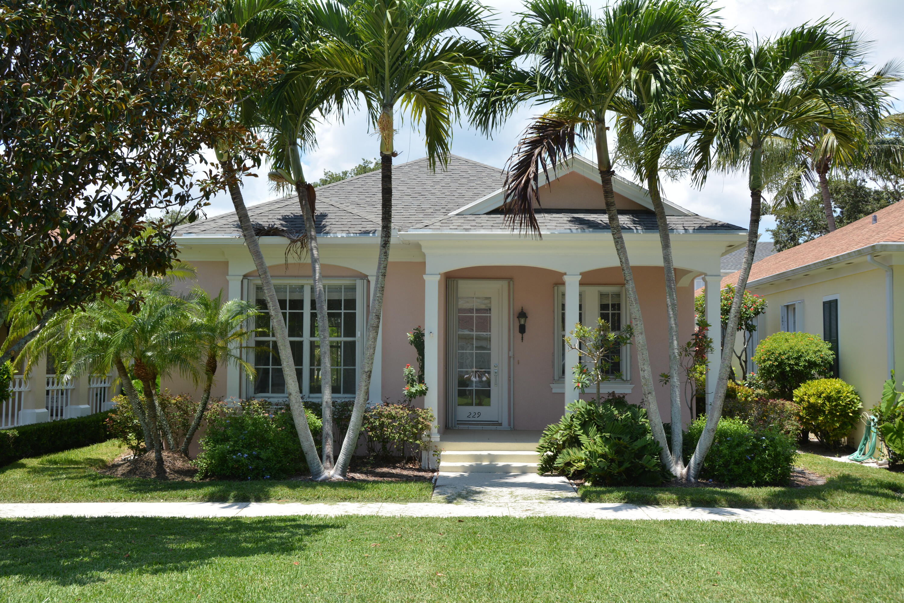 Adorable 2 BR/ 2 BA with fabulous park location. Sit out on your front porch and just enjoy the sunrise. Home has been completely repainted inside with Benjamin Moore Chantilly Lace, crown molding in bedrooms and baths, corian countertops in kitchen, screened pool with newly painted pool deck, accordion shutters, seller has left flooring to the new buyers choosing. A credit will be applied at closing for a new roof (Seller has obtained a quote).
