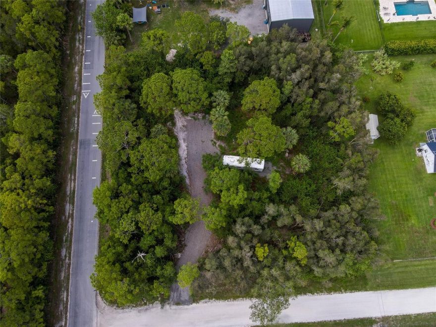 Build your dream home on this beautiful 1.34-acre corner lot in highly desirable Loxahatchee. This high-and-dry property sits on a quiet paved road and already includes a culvert, swale, and asphalt milled access- providing convenience, improved drainage, and easy entry onto the lot. Zoned AR, for single family home or agricultural uses, animals, barns, workshops, and accessory structures. Plenty of space for custom home, pool, guest house, barn or workshop, offering the flexibility you want. Enjoy peaceful, country-style living, no HOA, no restrictions- bring your boat, RV, toys, animals. Ideally located minutes from West Lake, top rated schools, shopping, dining, essential services. Quick access to major highways, easy commute. Large improved lots like this hard to find-your chance now