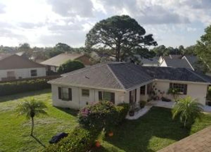 Indian Creek- 3 bedroom, 2 bath, split floorplan single family home with a 2 car garage. Home is on a quiet cul-de-sac, recently updated flooring and bathrooms. Great family home, pets welcome with deposits and no aggressive breeds. The community of Indian Creek is family oriented and kid friendly, yet quiet enough if considering a home during retirement. Membership to tennis and pool club included. Great central location,  Only 2 miles to I-95 and Florida Turnpike. 25 minutes to Palm Beach International airport & 5 miles to Jupiter's pristine beaches. Easy to show. Amazing outdoor space is what sets this home apart. Will not last long. All sizes approximate.