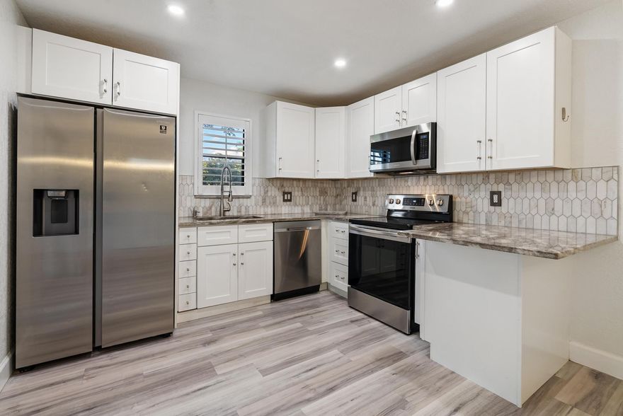 Completely remodeled 3bd / 2.5ba townhome in COURTYARDS AT BOCA located in the heart of Boca Raton. The property features an open and very spacious layout with vinyl floors throughout, Updated Kitchen with quartz countertops and Stainless Steel appliances, freshly painted inside, screened patio very private perfect for relaxing or entertaining. Courtyards at Boca is a quiet neighborhood situated just minutes from top-rated schools, shopping, dining, major highways, the beach, Town Center Mall, Mizner Park, places of worship and more. One assigned parking space plus guest spots available. The community offers a pool and many walking pats around. CABLE, INTERNET and TRASH are included in rent. Pets allowed with pet deposit. MUST SEE!