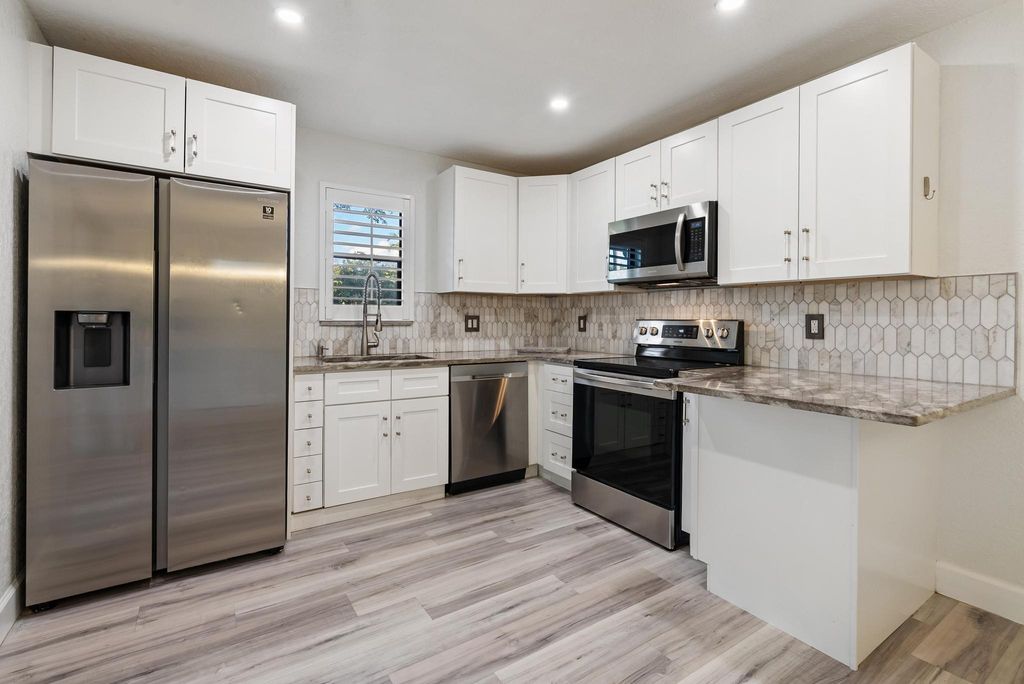 Photo of 7780 Courtyard Run W, Boca Raton, FL 33433 (MLS # B26023587)