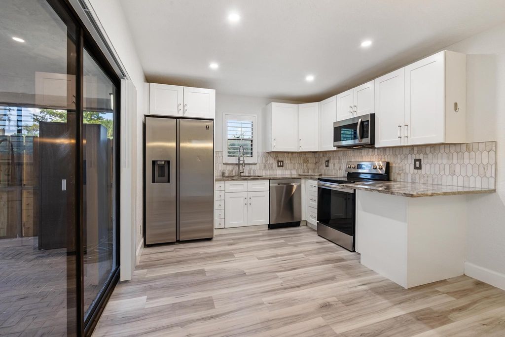Photo of 7780 Courtyard Run W, Boca Raton, FL 33433 (MLS # B26023587)