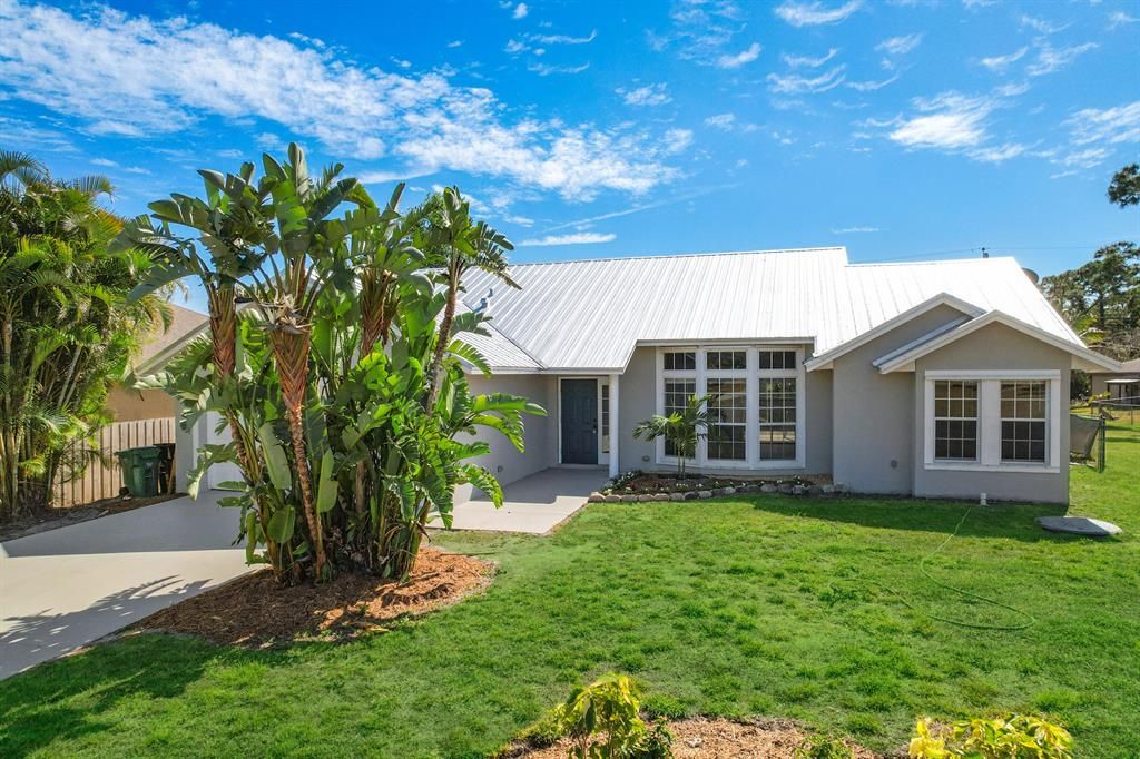 Photo of 1932 SW Delmonico Avenue, Port St Lucie, FL 34953 (MLS # R10876038)