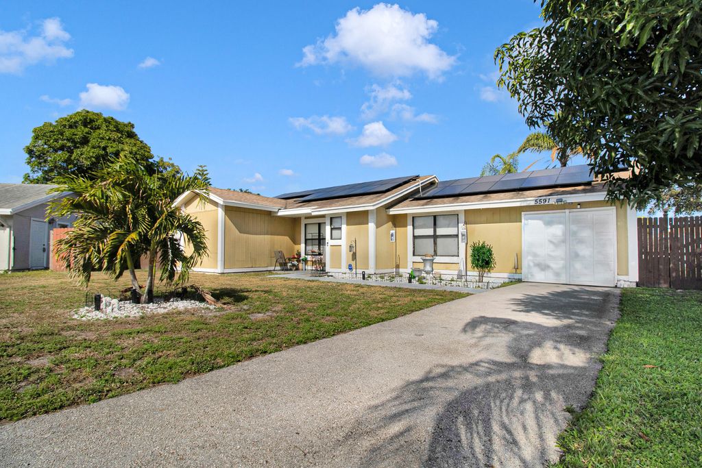 Photo of 5591 Cynwyd Circle, Lake Worth Beach, FL 33463 (MLS # R11164436)