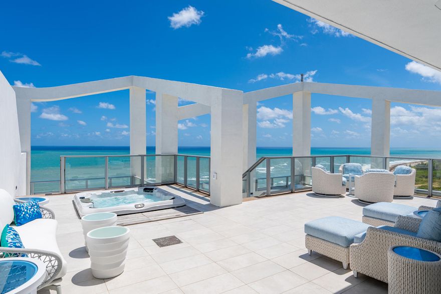20 floors above the coastline, this one-of-a-kind direct oceanfront penthouse offers over 6,000 sq ft of total space and 3,400 sq ft under air, with breathtaking, unobstructed Atlantic views. Thoughtfully designed with custom finishes and top-tier furnishings, it blends sophistication and comfort for elevated coastal living. The 3-bedroom plus den layout features expansive living areas, panoramic ocean views, and a fully integrated smart home system. A standout feature is the private rooftop oasis, accessed via an in-residence lift, complete with dining area, grill, firepit, lounge seating, and hot tub, perfect for sunset entertaining. Ideally located near Palm Beach Island, Jupiter and PGA Boulevard.