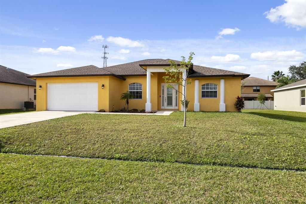 Photo of 2062 SW Burman Lane, Port Saint Lucie, FL 34984 (MLS # R10766036)