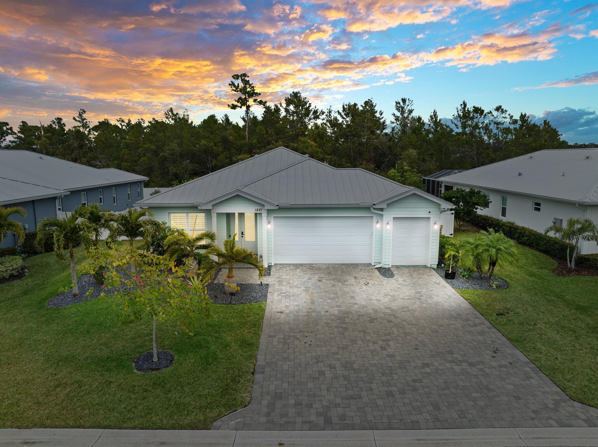 Gorgeous newly built home in the newer neighborhood of River Oaks. Tastefully designed homes built by one of Martin County's luxury builders, Showcase Designer Homes. You will love the open layout for entertaining and family gatherings! Four bedrooms, three full baths, and a full-size den provide ample space for a family and a home-based office! The well-appointed home features a designer kitchen with quartz countertops, 42-inch white cabinets, SS appliances, and a breakfast bar. Luxurious primary bedroom suite with walk-in closet and spa-like MBA. Custom coffered ceilings with millwork throughout and luxury wood like floors are features found only in luxury homes. Impact windows, doors, and a metal roof add peace of mind while providing the best insurance rates. Private backyard is