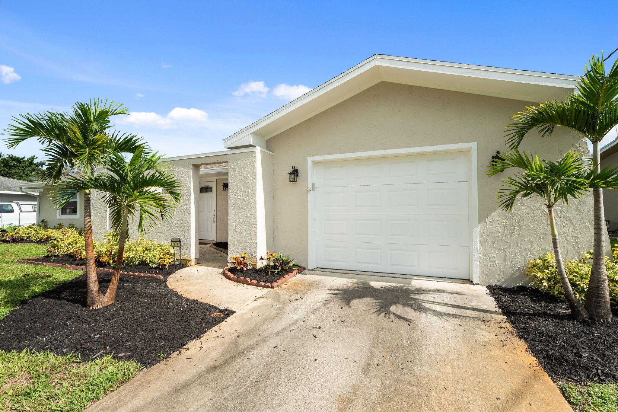 Fully Remodeled Gem with Solar & Peaceful Outdoor Living! Welcome to 372 SE Oakridge Dr. in beautiful Port St. Lucie! This move-in ready home was completely remodeled in 2023, offering modern comfort and peace of mind from top to bottom. Enjoy impact windows, a new roof, new appliances, and a new A/C system -- all updated to current standards. The solar system is paid off and transferrable and helps keep your energy bills low, and with low insurance costs, this home is as smart a financial choice as it is beautiful. Step outside to your peaceful back porch, perfect for relaxing evenings or morning coffee, surrounded by Florida's natural charm. A shed in the backyard provides great extra storage. There's a boat ramp real close for quick access to the water.