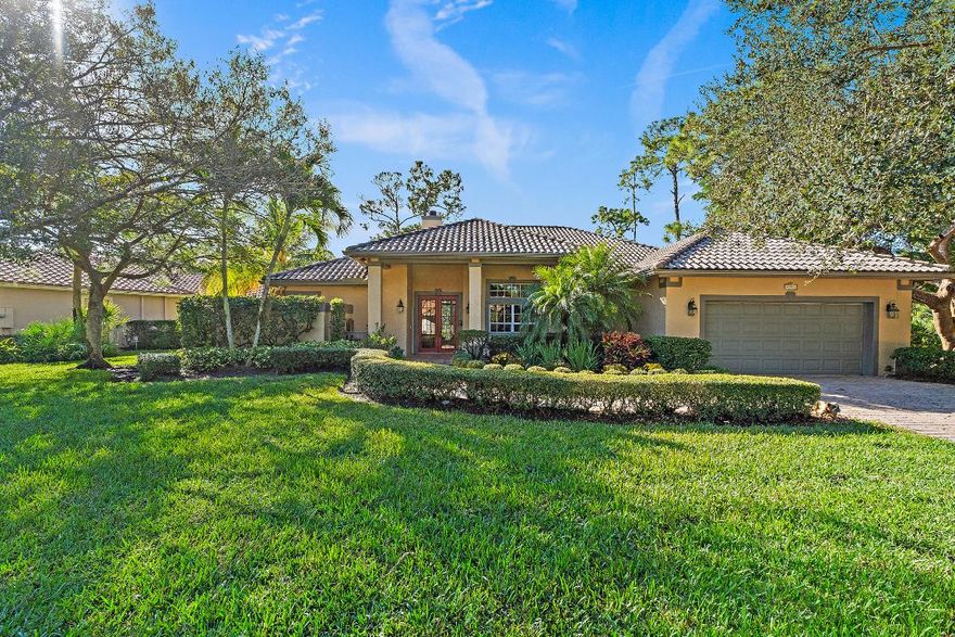 Tucked away in the coveted waterfront community of Locks Landing, this exceptional 4-bedroom lakeside estate is set on an **oversized corner lot, one of the largest in the neighborhood offering rare privacy, natural beauty, and endless potential. 

Surrounded by towering native trees and protected habitat, the home enjoys peaceful lake views through the trees, creating a tranquil, nature-forward setting. A charming double-sided fireplace anchors the living room and primary suite, adding warmth and character while enhancing the home's inviting atmosphere.

Designed with flexibility in mind, one of the bedroom suites features a private exterior entrance, making it ideal for guests, extended family, or a private retreat. The expansive lot provides ample room to customize. Whether you envision adding a third garage, additional storage, a luxury-sized pool, an addition, a guest house, or a garden oasis.

Residents enjoy access to a private marina, scenic wooded nature trail. just 100 yards from marina. Boat slips may be available through the homeowner's association, offering convenient access to the water. The enchanting trail continues from the north side of the marina along the Okeechobee Waterway to Locks Park, approximately a half-mile stroll beneath a lush canopy of trees perfect for walking, biking, or simply enjoying the outdoors.

This is a rare opportunity to own a lakeside home with space, privacy, and connection to nature in one of the area's most desirable waterfront communities.