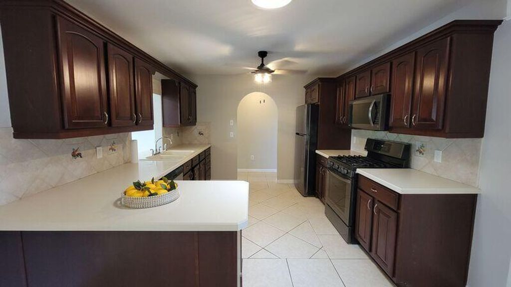 Photo of 2442 SE Grand Drive, Port Saint Lucie, FL 34952 (MLS # R11074554)
