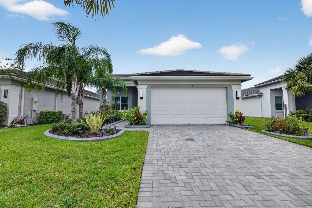 Photo of 13444 SW River Rock Road, Port Saint Lucie, FL 34987 (MLS # B26074622)