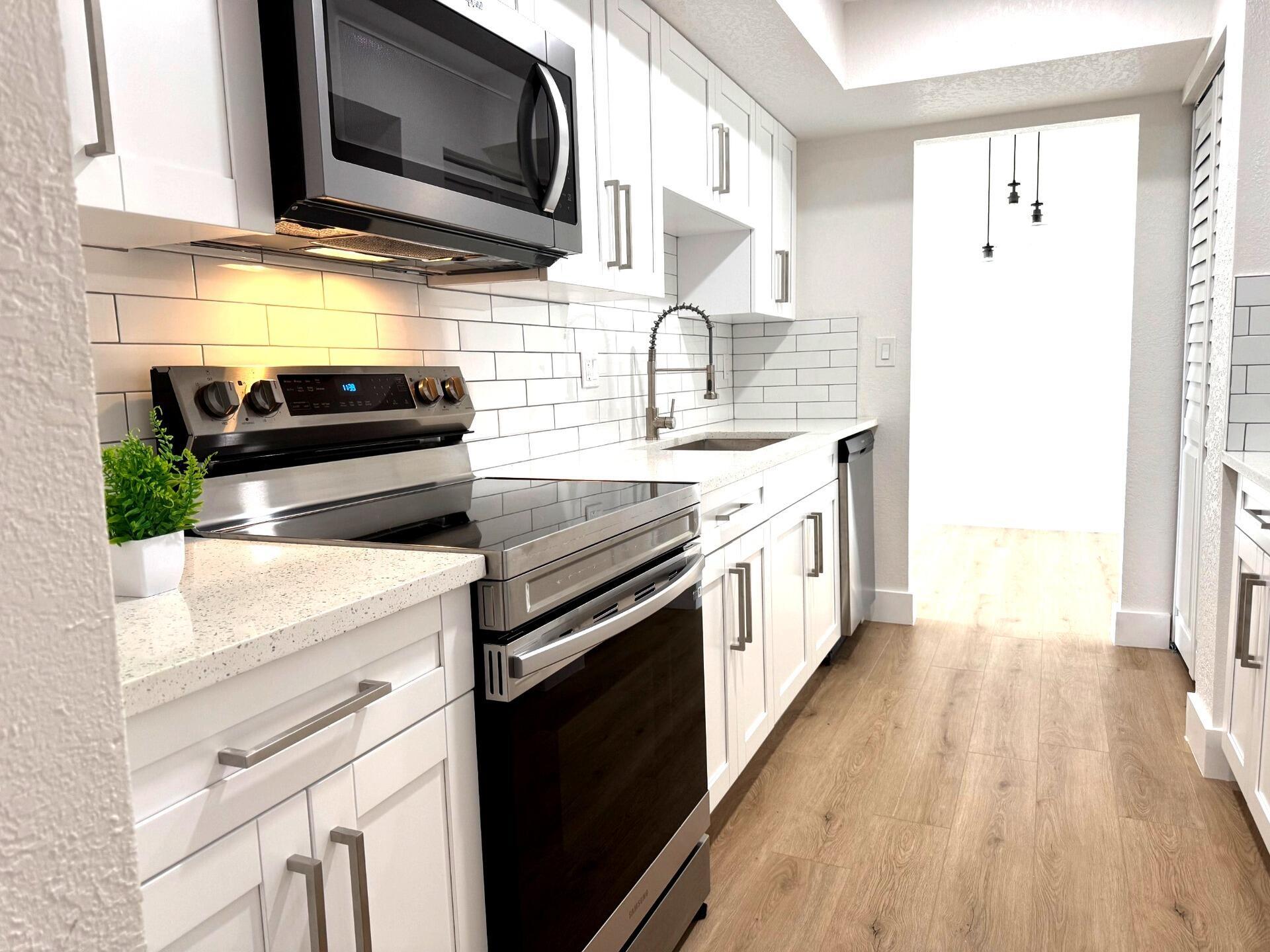 Completely remodeled 2-bedroom, 2-bath unit in the highly sought-after Environ community. This turn-key condo features modern vinyl flooring throughout and a beautifully upgraded kitchen with new white shaker cabinets, quartz countertops, recessed lighting, and brand-new appliances including a dishwasher, stove, microwave, and air conditioner. Large bedrooms offer walk-in closets, stylish barn doors, and modern ceiling fans. Both bathrooms have been tastefully renovated with contemporary finishes. Enjoy a spacious, open layout with serene views and access to resort-style amenities, including a clubhouse, pool, and fitness center. Gated community with 24-hour security.670 minimum required credit score. Income $42,000 individually/$60,000 combined. HOA requires $1,000.00 deposit.