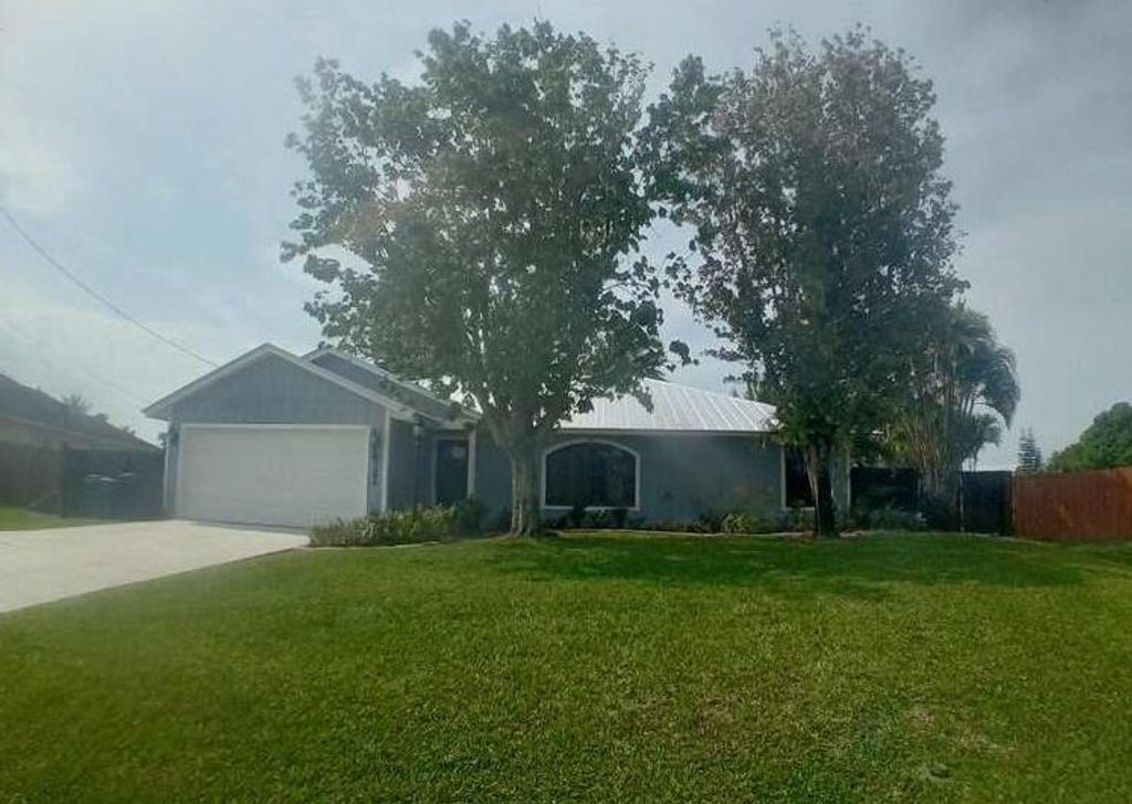 Photo of 4322 SW Jarmer Road, Port Saint Lucie, FL 34953 (MLS # R10967283)