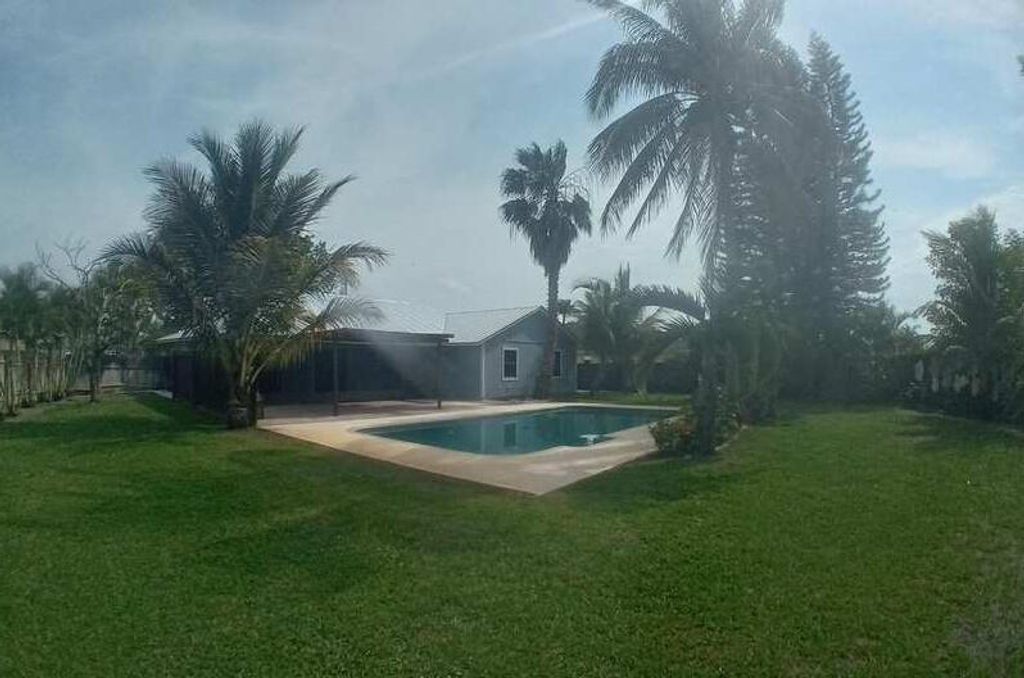 Photo of 4322 SW Jarmer Road, Port Saint Lucie, FL 34953 (MLS # R10967283)